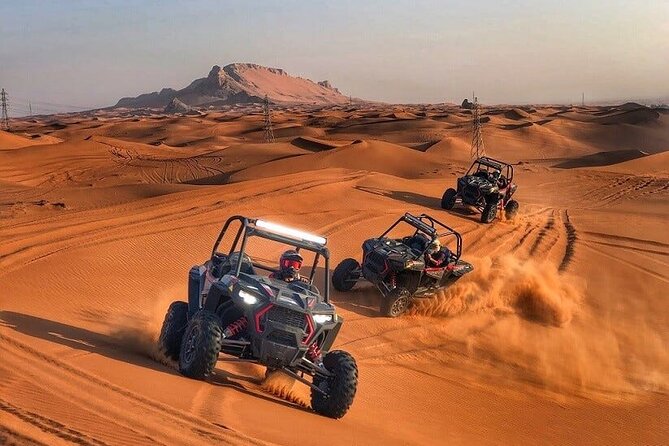 Adventurous Red Dune Desert Safari Deal with Quad Bike,Shows &BBQ - Red dunes, roaring engines, and a busy evening