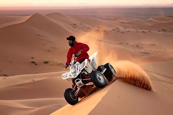Adventurous Red Dune Desert Safari Deal with Quad Bike,Shows &BBQ - Camel ride, sandboarding, and costume photos