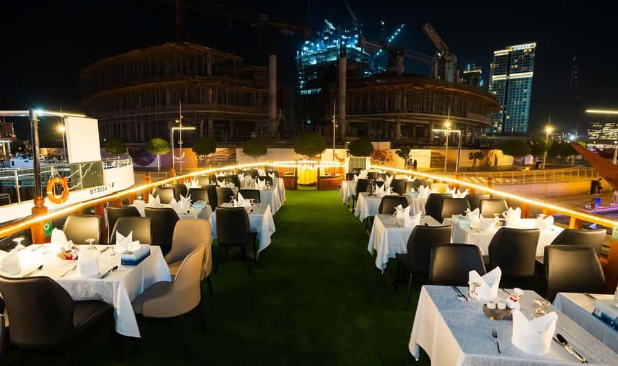 Best 5-Star Dhow Dinner Cruise Dubai Marina Jack Sparrow - The Jack Sparrow dhow and Dubai Marina after dark
