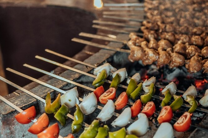 Deluxe Sunset Desert Safari: SandSurfing, Camel Ride & BBQ dinner - Fire, Tanoura, and belly dancing after dark