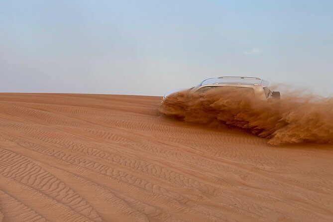 Desert safari adventure with BBQ dinner - Camel riding and sandboarding in 45 minutes