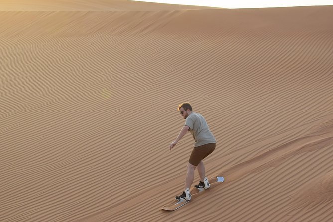 Desert Safari Tour, Quad Bike with BBQ Dinner & Show from Dubai - Sunset photos and sandboarding