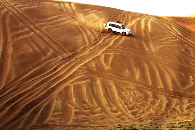 Doha Desert Safari Dune Bashing Camel Ride Sandboarding - Sandboarding adds a simple, hands-on stop
