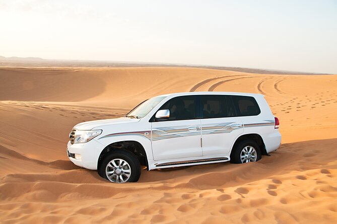 Doha Desert Safari Dune Bashing Camel Ride Sandboarding - Sunset or sunrise: choose the mood you want