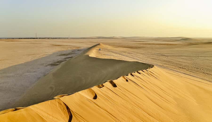 Doha: Desert Safari Dune Bashing, Sandboarding, & Camel Ride - From Doha streets to Qatar’s southern desert