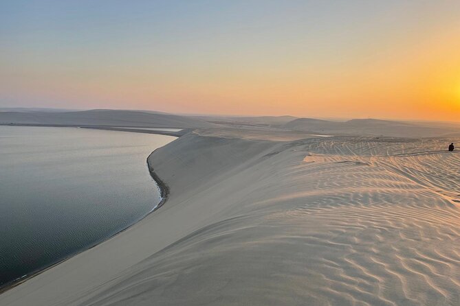 Doha: Desert Safari, Sand Boarding, Camel Ride & Inland Sea Tour - Dune bashing across Qatar’s southern sand