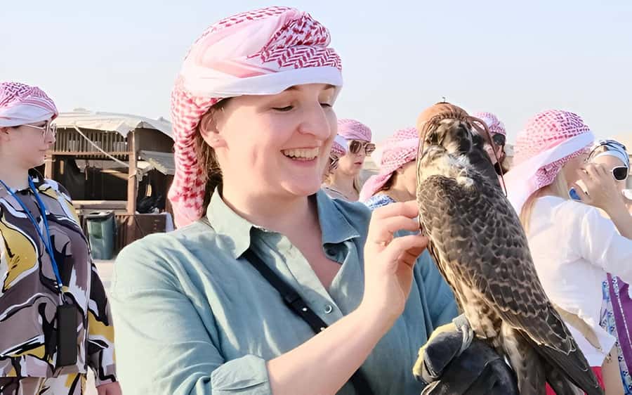 Doha: Desert Safari with Quad Bike, Sandboard & Camel Ride - Meeting camels and falcons with local hosts
