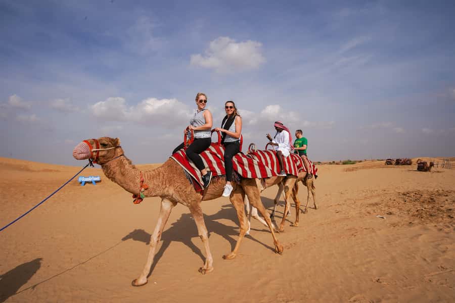 Dubai: Adventure Quad Bike Safari, Camel Ride & Refreshment - Sandboarding across the dunes