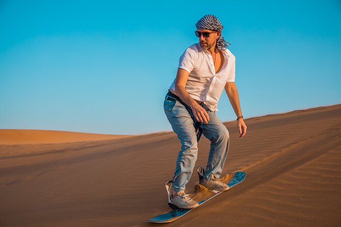 Dubai: Adventure Quad Bike Safari, Camel Ride & Refreshments - Sandboarding adds a short, playful challenge