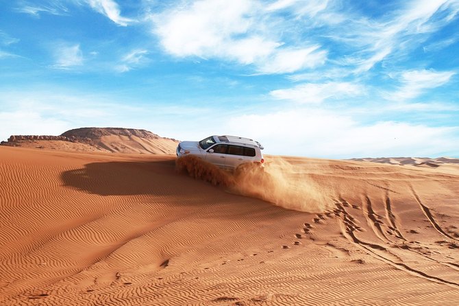 Dubai Desert Bespoke: Red Dunes Safari, Camel Ride & BBQ Options - The 50-minute ride from Dubai to Lahbab