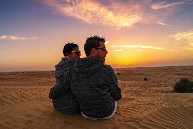 Dubai Desert Discovery: Red Dunes Safari, Sandboard & Camel Ride - Sandboarding on the golden slopes