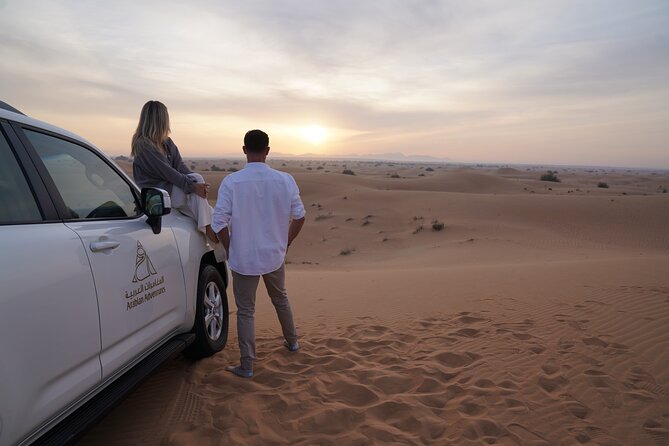 Dubai Desert Safari: Camel Ride, Sandboarding, BBQ & House Drinks - Timing, weather, and cancellation