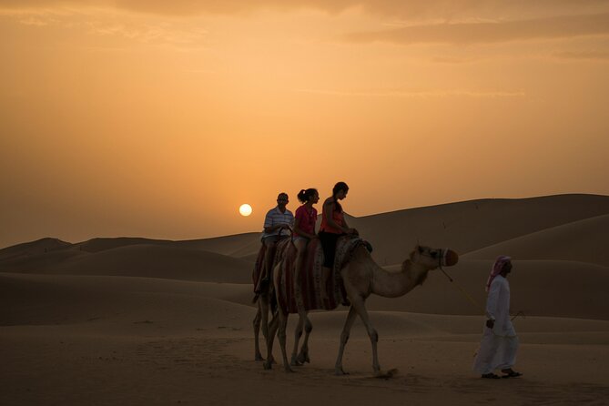 Dubai Desert Safari, Dune Bashing, Camel Ride, Sandboarding & BBQ - Red dunes, rough rides, and a full desert evening