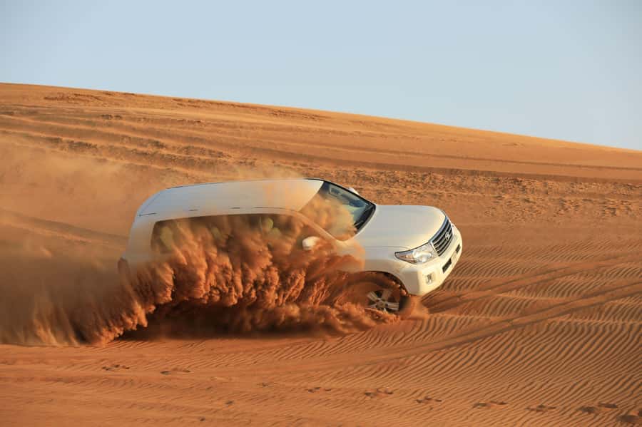 Dubai: Desert Safari, Quad Bike, Sandboarding, Camels & BBQ - BBQ dinner and a busy evening program