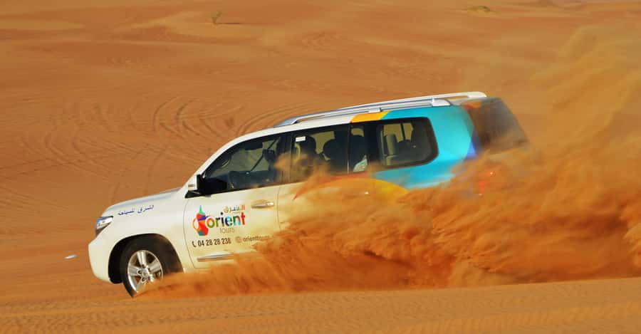 Dubai Desert Safari, Quad Biking, Camel Ride, & Sandboarding - Sandboarding and the short camel ride