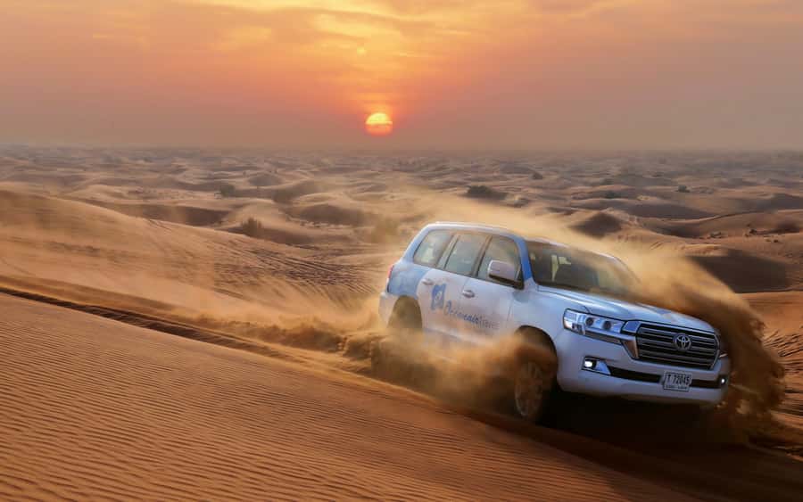 Dubai: Desert Safari with Camp, Dinner, & Optional Overnight - From Dubai hotel pickup to the red dunes