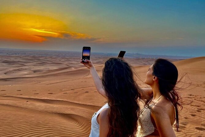 Dubai Evening Desert Safari With Transfers Dune Bashing & Dinner - Dune bashing, sandboarding, and sunset photographs
