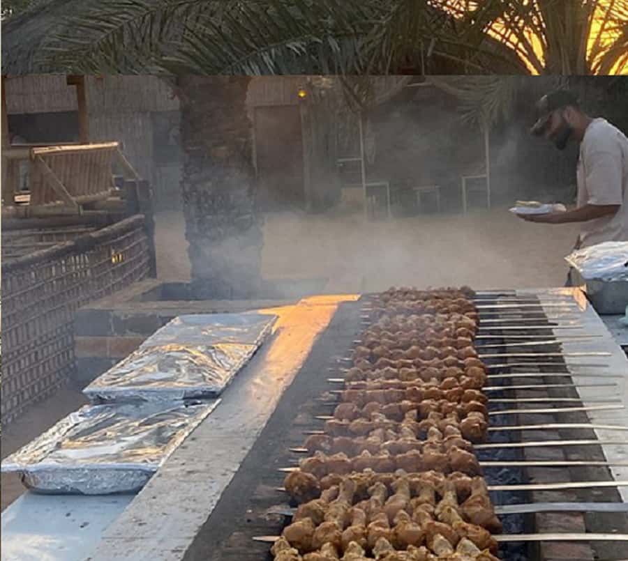 Dubai: Evening Tour with Quad Biking, Camel Ride, and BBQ - From city pickup to the red dunes