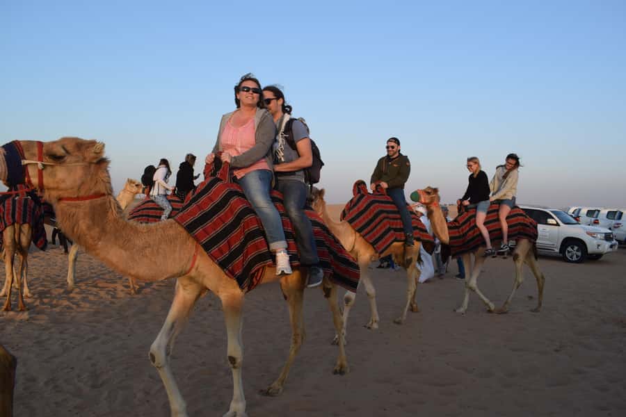 Dubai: Evening Tour with Quad Biking, Camel Ride, and BBQ - Dune bashing across the red sand