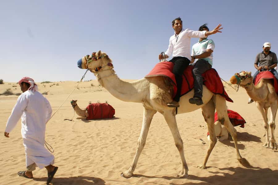 Dubai: Evening Tour with Quad Biking, Camel Ride, and BBQ - Optional quad biking on the open sand