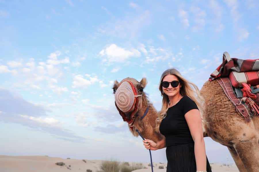 Dubai: Half-Day Desert Safari, Camel Ride, ATV & Dune Buggy - Sandboarding is simple, photogenic fun