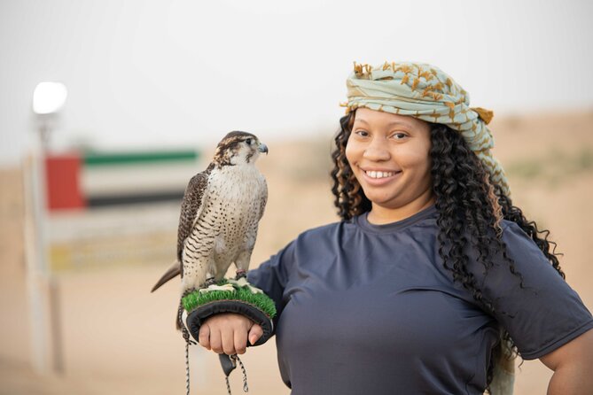 Dubai Half-day Red Dunes bashing with Sandboarding, Camel &Falcon - Falcon photos and Arabic-style pictures