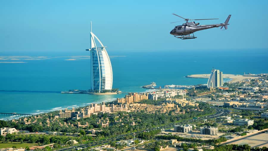 Dubai: Helicopter Ride, Desert Safari, Camels & Refreshments - Sandboarding, photographs, and a short camel ride
