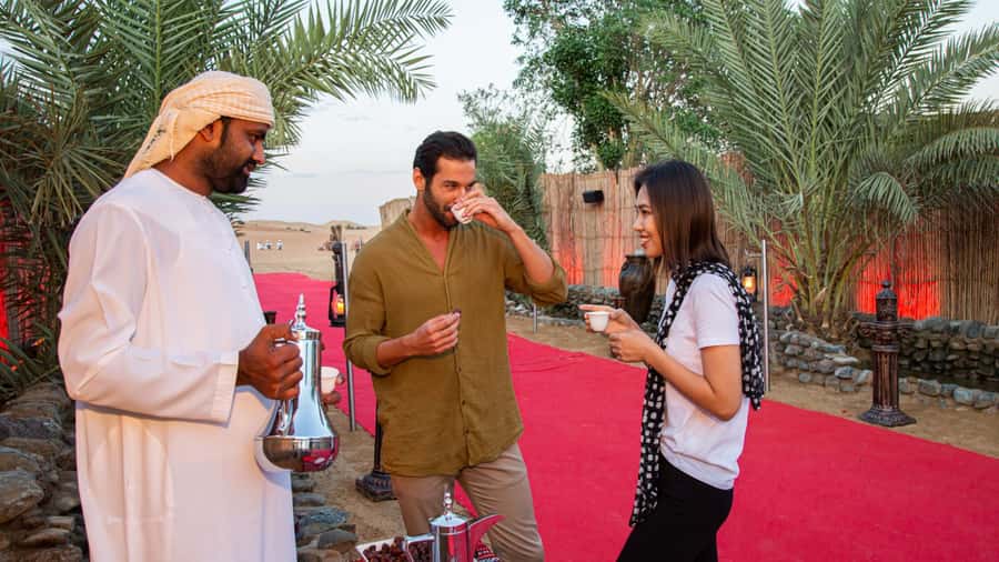 Dubai: Premium Desert Safari, Camel Ride, BBQ & Sandboarding - Camel ride, sandboarding, and henna