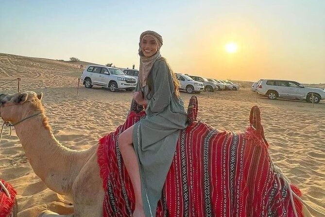 Dubai Premium Desert Safari – Live Buffet Dinner & Luxury Camp - Camel riding at the camp