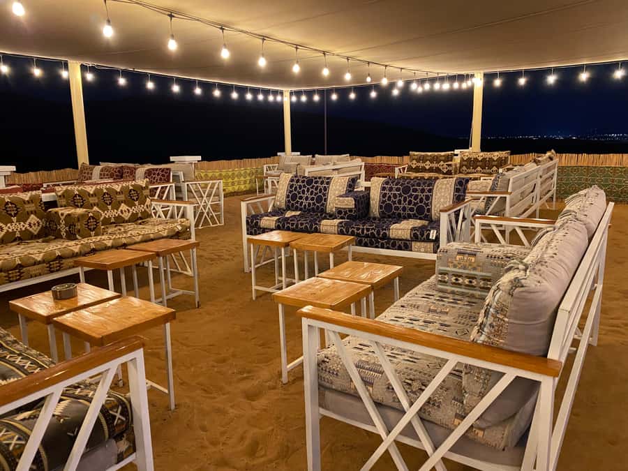 Dubai: Private Desert Buggy Tour, Camel Ride & Sandboarding - Red dunes and a low-slung Polaris buggy