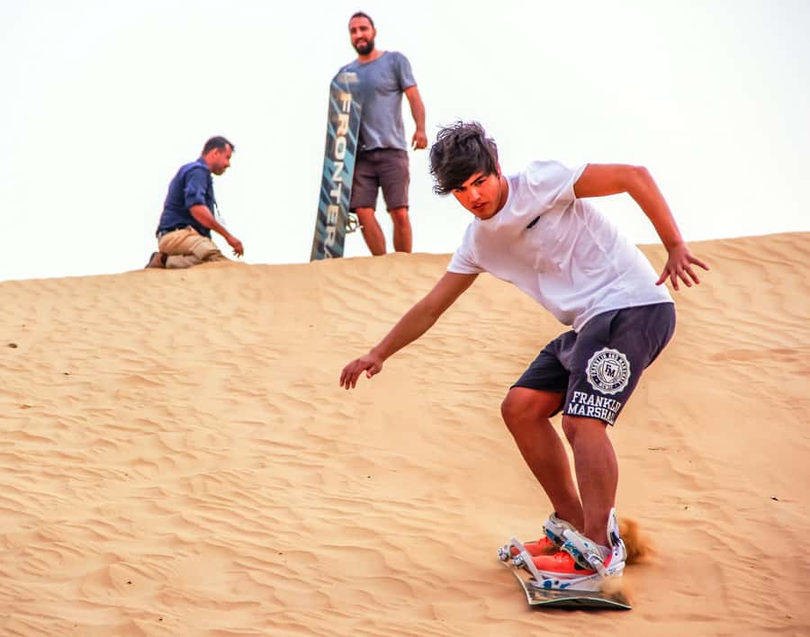 Dubai: Private Desert Day Tour and Wadi Shawka Pool Visit - Sandboarding and dune bashing: the most reliable fun
