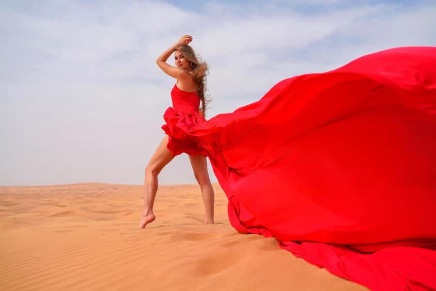 Dubai: Private Flying Dress Photography and Dune Drive Trip - Picking the dress before you reach the dunes