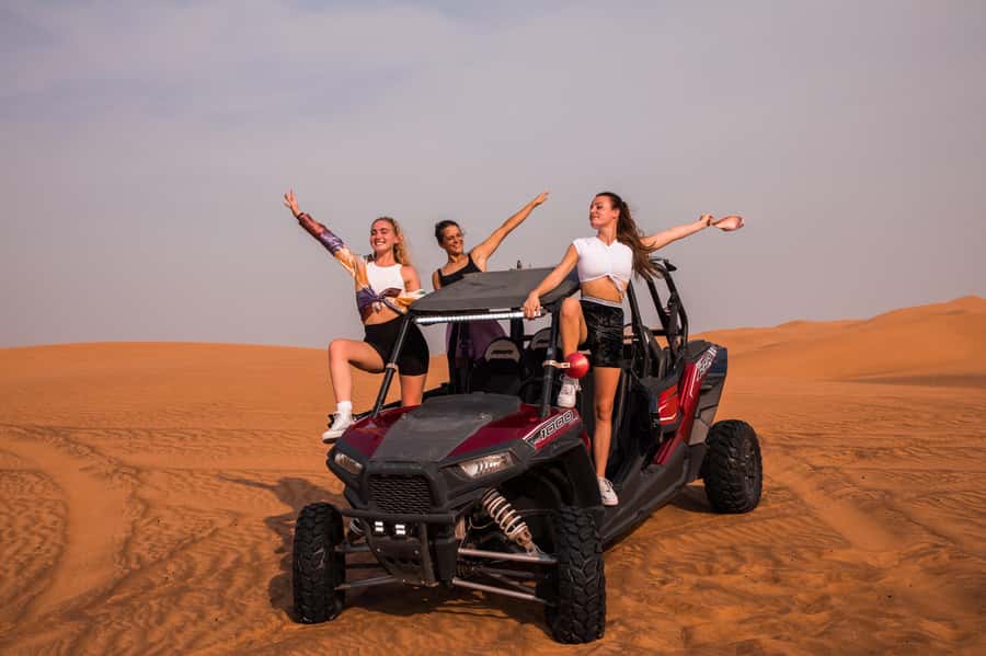 Dubai: Red Dune Desert Safari, Quad Bike, Camels, and BBQ - Sandboarding on the steep red dunes