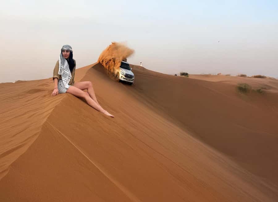 Dubai: Red Dunes Desert Safari with Premium Camp BBQ & Shows - A short camel ride and falcon photo stop