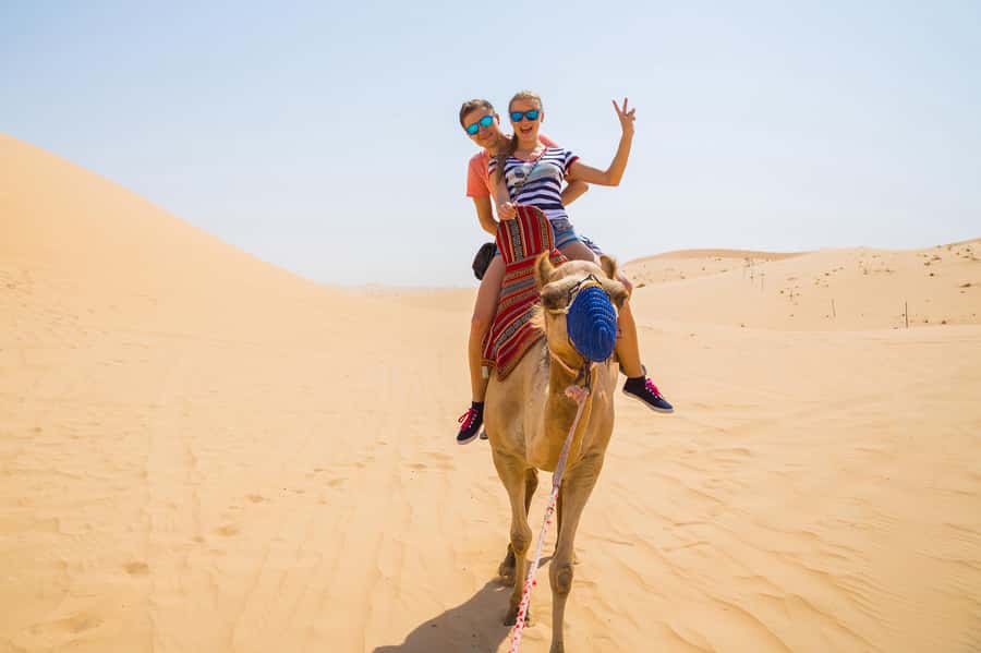Dubai: Red Dunes Quad Bike with Sandboarding, Camels and BBQ - The red dunes begin after a 45-minute drive