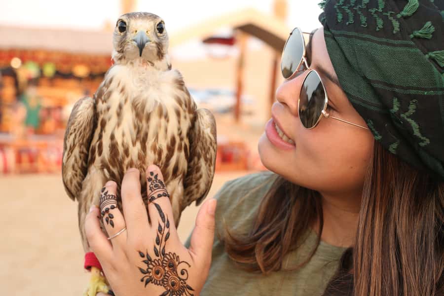 Dubai: Red Dunes Quad Bike with Sandboarding, Camels and BBQ - Fire, horses, camels, falcons, and Yola dancing