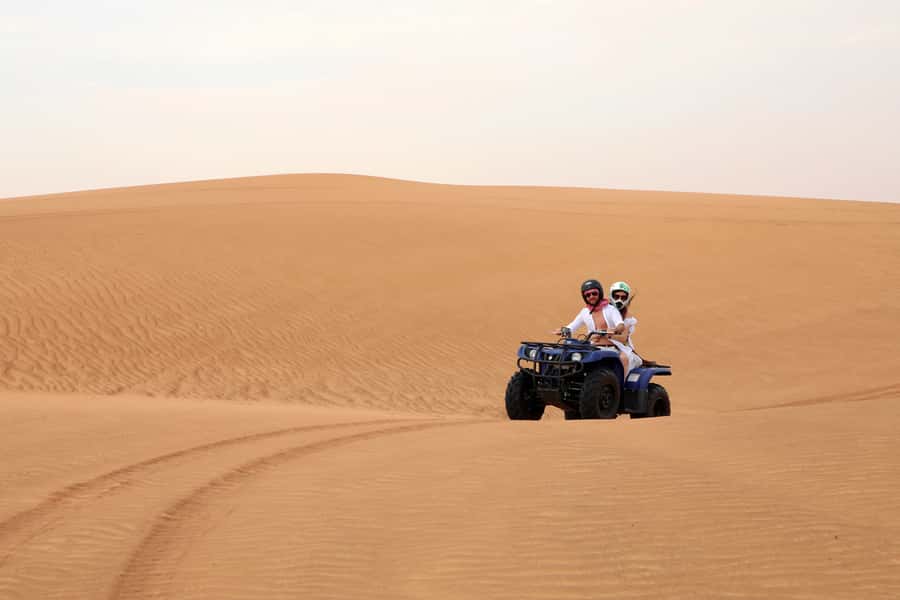 Dubai: Red Dunes Quad Bike with Sandboarding, Camels and BBQ - Who should book this desert experience?