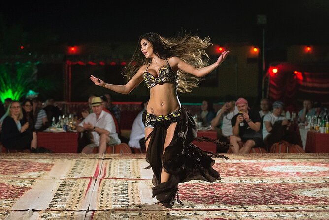 Dubai: Red Dunes, Sandsurf, Camel Ride, BBQ Dinner at Desert Camp - Sunset at the desert camp