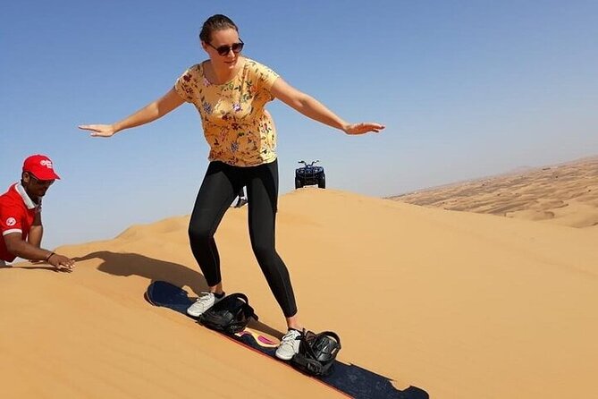Dubai Self-drive Quad Bike, Sand Boarding, Camels & Refreshments - Taking control of a quad bike