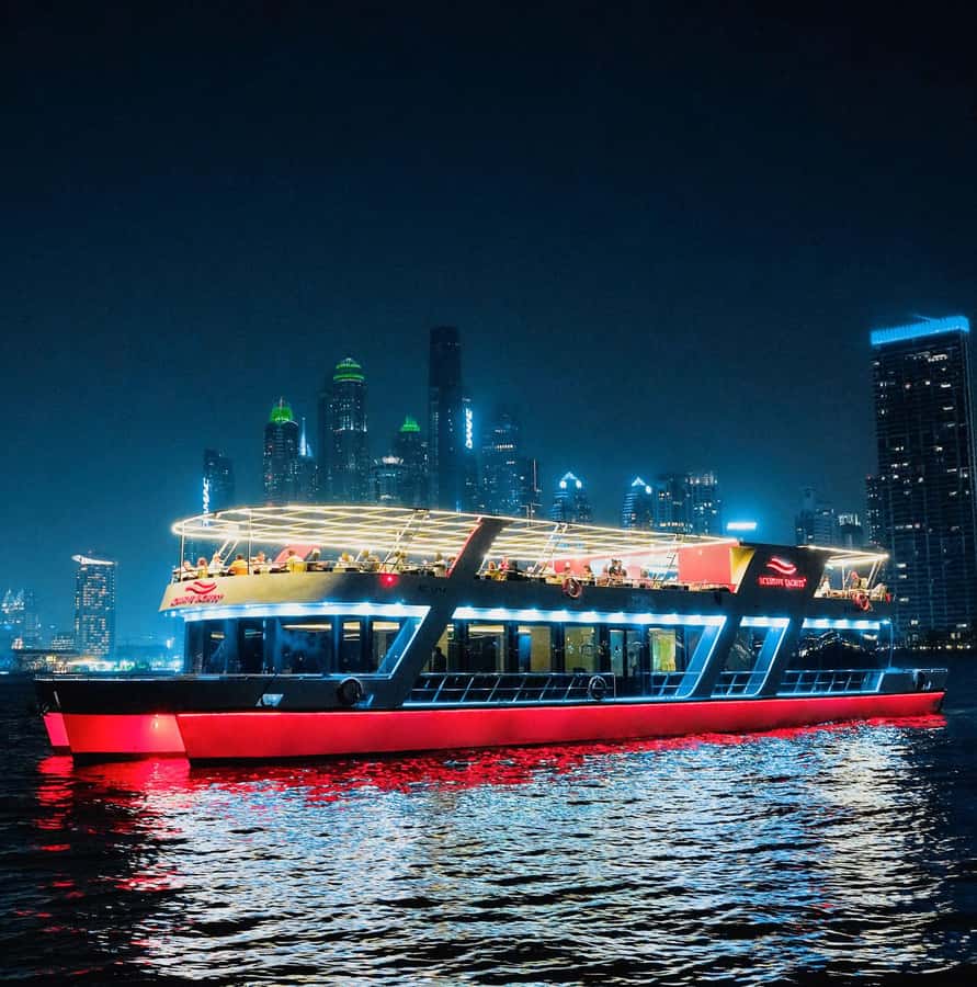 Dubai: Sunset or Dinner Cruise with Live Music & Open Bar - Dubai Marina after sunset, seen from the water