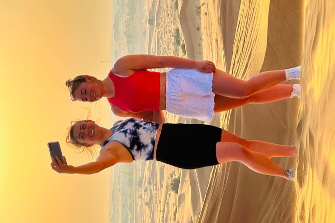 Dubai Sunset Red Dune Desert Safari, Sandboarding and Camel Ride - Sunset photos are worth protecting time for