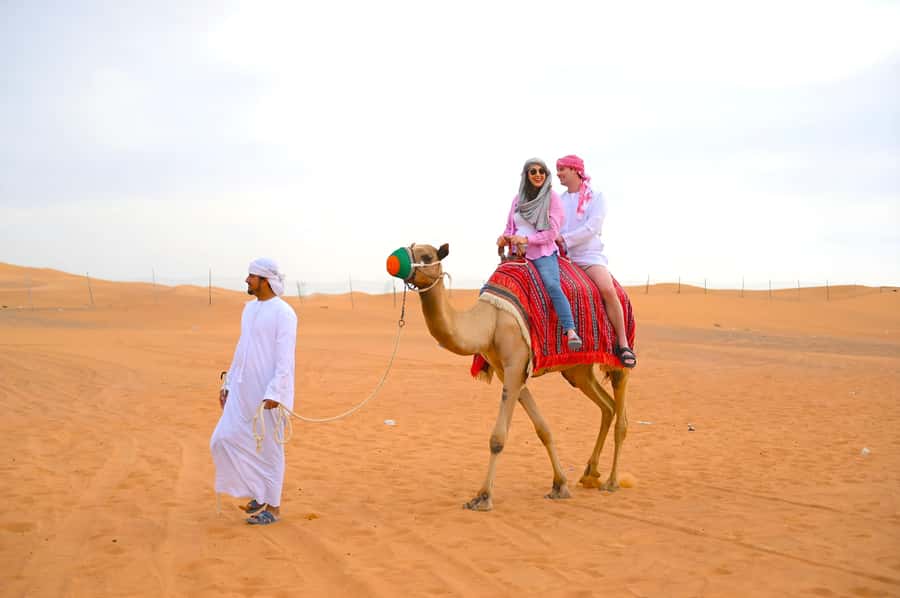 Dubai: Tour with BBQ Dinner, Camel Ride, & Traditional Show - From Dubai pickup to the Al Aweer desert