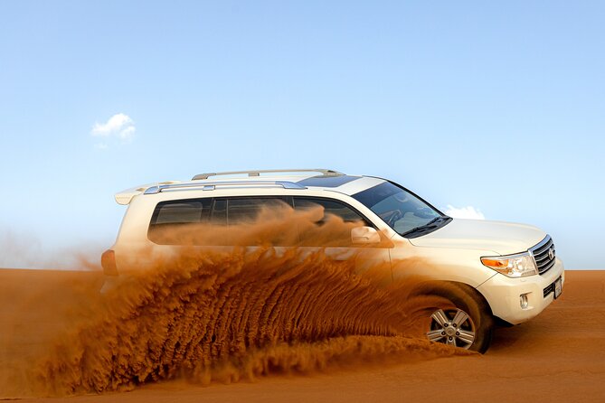 Evening Desert Safari in Dubai, Sandboard & BBQ Dinner - Sandboarding, with room for another try