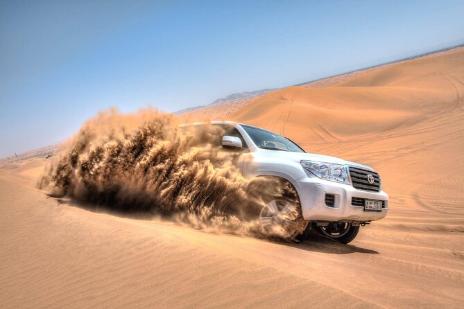 Evening Red Dunes Safari with Quad Biking, BBQ Dinner & LiveShows - Dune bashing in a powerful 4x4