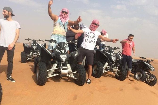 Evening Red Dunes Safari with Quad Biking, BBQ Dinner & LiveShows - Belly dancing, Tanoura, and fire performance