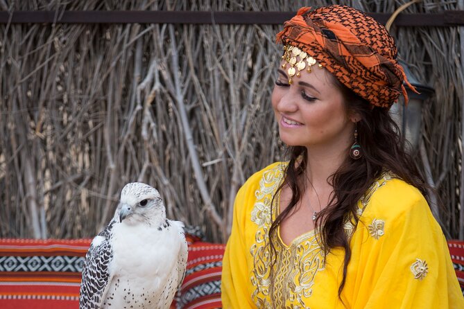 High Red Dunes with Camel Ride, Sandboarding, Falcon Show and VIP BBQ Dinner - Belly dance, Tanoura, and the evening program