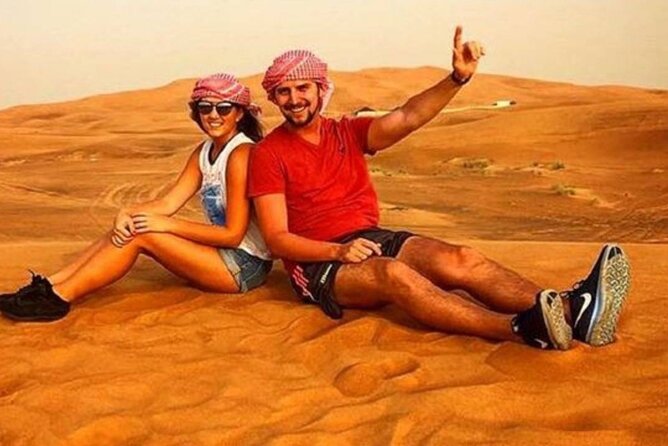 Morning Desert Safari with Quad Bike, Camel Ride & Sandboarding - Camel riding: brief, traditional, and sometimes shared