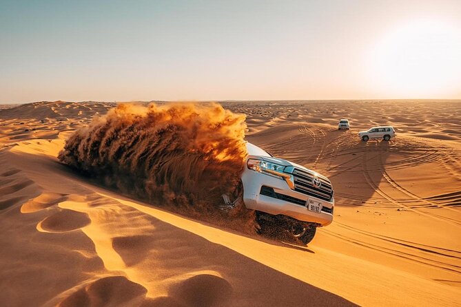Morning Red Dunes Safari: Camel Ride & Sandboarding Adventure - Sandboarding on the Red Slopes