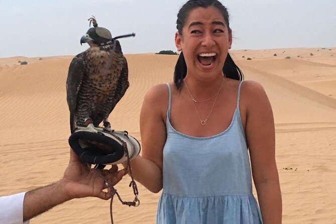 Morning Red Dunes with Camel Ride, Sandboarding and Refreshments - Falcons, camels, and a taste of camp life