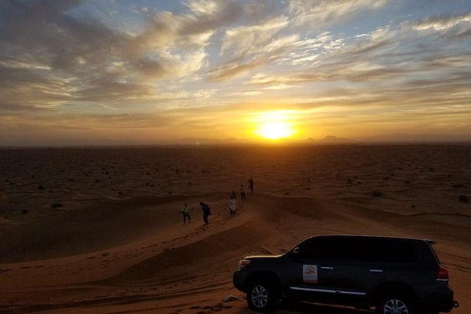 Private Evening Red Sand Desert Safari with BBQ Dinner - Sunset photos on the high dune